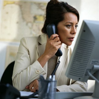 a woman talking on the phone at work