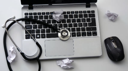 laptop with a stethoscope